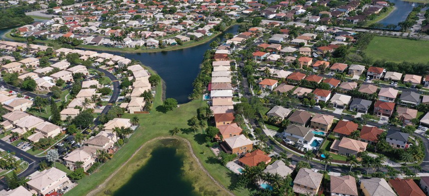 In an aerial view, single family homes are shown in a residential neighborhood on May 10, 2022 in Miami. 