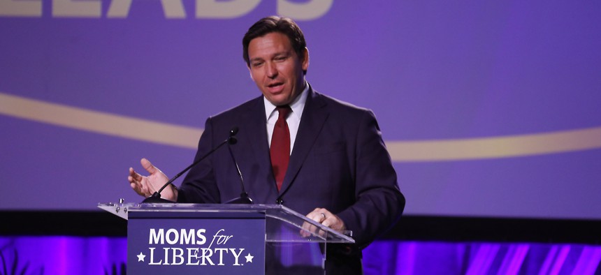 Gov. Ron DeSantis speaks during the inaugural Moms For Liberty Summit in Tampa July 15, 2022. He wants Medicaid to stop paying for certain kinds of transgender care. 