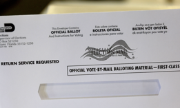 A vote-by-mail ballot envelope is shown to media at the Miami-Dade Election Department headquarters on July 21, 2022 in Miami. The department began mailing the domestic vote-by-mail ballots to voters with a request on file for the August 23, 2022 Primary Election. 