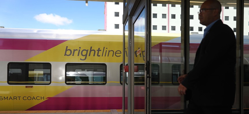 In this file photo, Brightline passengers use the MiamiCentral terminal to board for a trip from Miami to West Palm Beach on May 11, 2018 in Miami. 