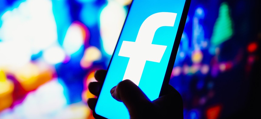 In this photo illustration, the Facebook logo is seen on a smartphone.