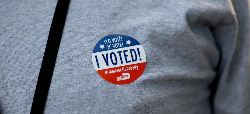 A voter wears an "I Voted" sticker after voting in a polling station on August 23, 2022 in Miami. 
