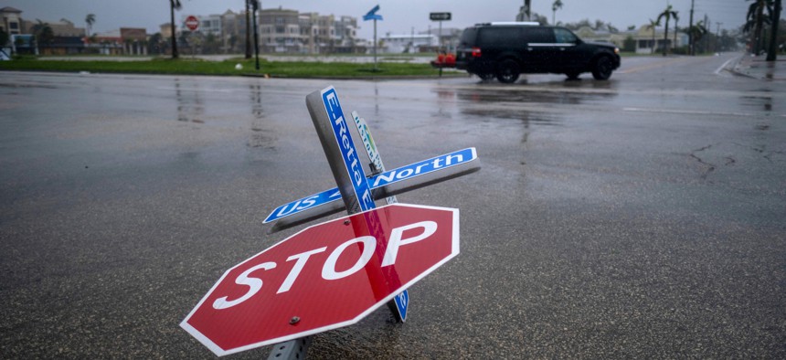 A street sign is seen lying on the ground as the eye of Hurricane Ian passes by in Punta Gorda on Sept. 28, 2022.