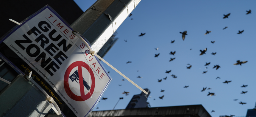 A Gun Free Zone sign is seen near Times Square on October 11, 2022 in New York City.