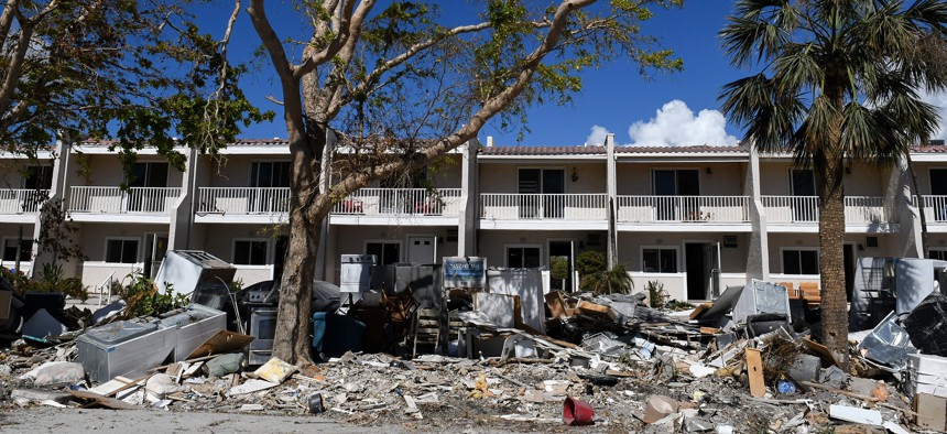 Debris from the Seawind Condominiums is seen along the road in Sanibel Island, Florida on Oct. 31, 2022, over a month after Hurricane Ian made landfall as a Category 4 hurricane. The storm caused an estimated $67 billion in insured losses and at least 127 storm-related deaths in Florida. 