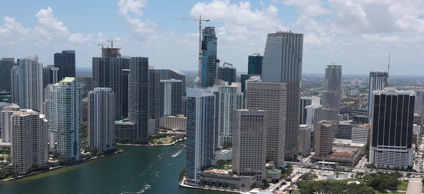 An aerial view of the City of Miami skyline is seen next to the waters of Biscayne Bay on July 21, 2022. 