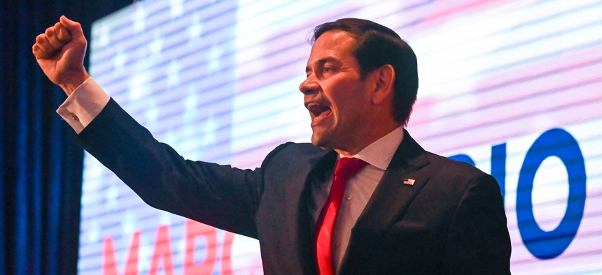Rubio raises his fist during his election night watch party at the Hilton Miami Airport Blue Lagoon in Miami, Nov. 8, 2022.