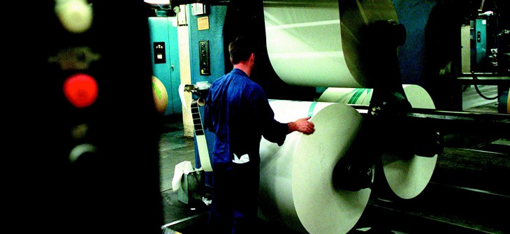 A printer is at work at a newspaper printing press in this February 2002 file photo.