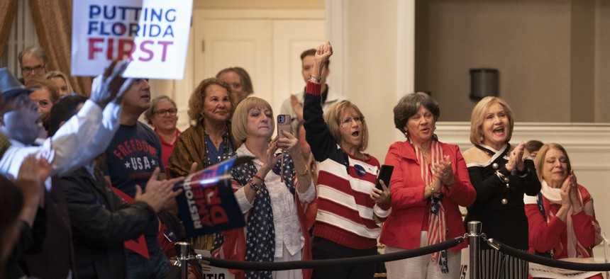 Crowd members react during the Republican Party of Miami Dade County GOP Victory Rally at Renaissance Ballrooms in West Miami, on Oct. 19, 2022. 