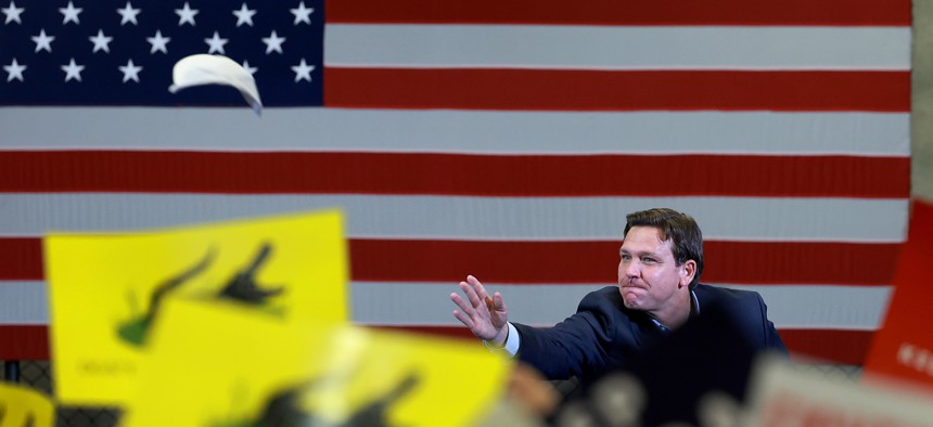 Gov. DeSantis tosses a hat into the crowd during a “Don’t Tread on Florida Tour" campaign event held at the American Top Team facility on Nov. 4, 2022 in Coconut Creek. 