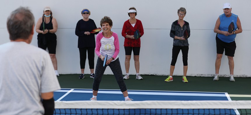 Pat Harrell (center) listens during a pickleball class at the John Knox Village Continuing Care Retirement Community in Pompano Beach in this March 2021 file photo. 