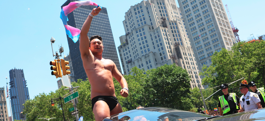 Schuyler Bailar, the first transgender athlete to compete in any sport on an NCAA Division I men’s team and NYC Pride grand marshal, waves as he participates in the New York City Pride Parade on Fifth Avenue on June 26, 2022 in New York City. 