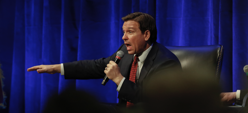 Florida Gov. Ron DeSantis responds to a question from Hillsdale College President Dr. Larry Arnn during an appearance at Hillsdale College on April 6, 2023 in Hillsdale, Michigan.