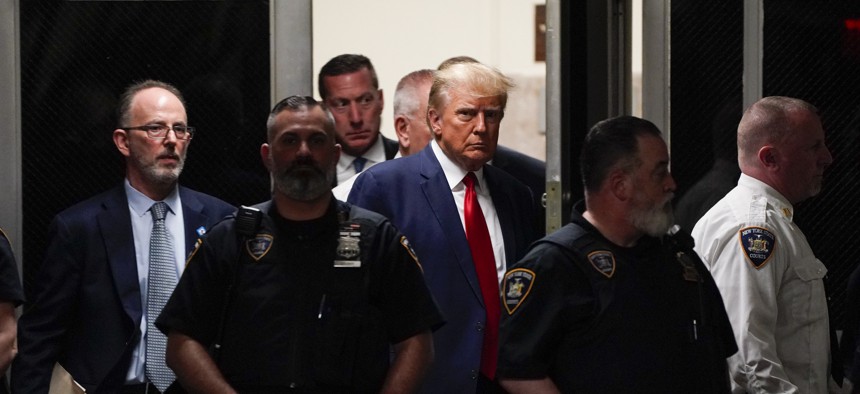 Former President Donald Trump arrives for his court appearance in New York, NY on Tuesday, April 4, 2023, becoming the first sitting or former U.S. president to be indicted and turn himself to be arraigned in a case that involves payoffs through an intermediary to adult-film actress Stormy Daniels to conceal an alleged affair ahead of the 2016 election. 