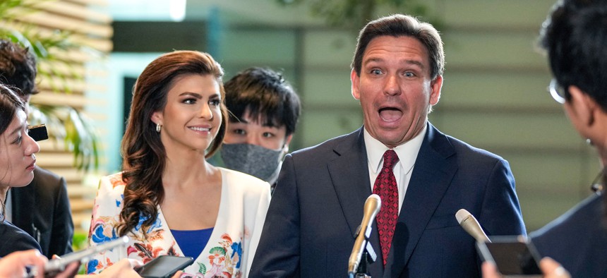 Florida Gov. Ron DeSantis reacts as he speaks with journalists and his wife Casey looks on, after meeting Japanese Prime Minister Fumio Kishida at the latter's official residence in Tokyo, April 24, 2023. 