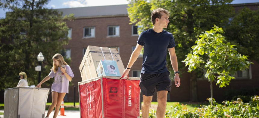 Michael Swift of Chicago got some help from his sister, Samantha, moving bins of his stuff into Territorial Hall along with the other first year students moving into dorms Tuesday afternoon, August 30, 2022 on the University of Minnesota Minneapolis campus.