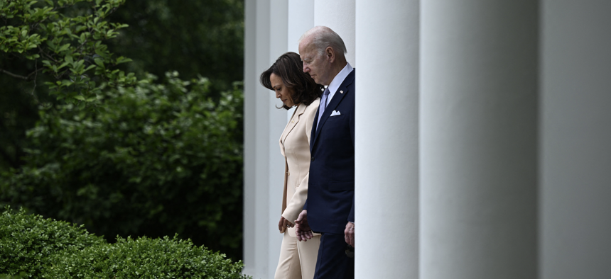 Vice President Kamala Harris and President Joe Biden arrive to deliver remarks during National Small Business Week, in the Rose Garden of the White House, May 1, 2023. 