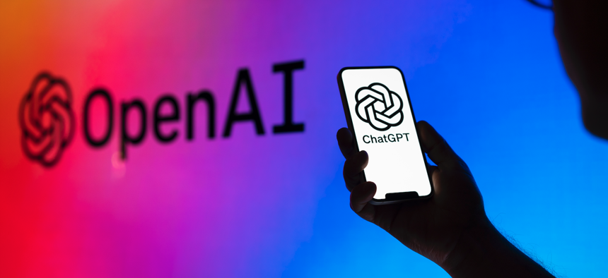 OpenAI and ChatGPT logos are seen on electronic device screens in this photo illustration on May 31, 2023 in Warsaw, Poland. 