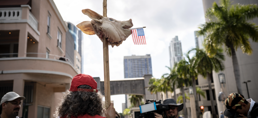 A real pig head on a stake outside the Wilkie D. Ferguson Jr. U.S. Courthouse in Miami, Fla. on Tuesday, June 13, 2023. Former President Donald Trump appeared in court to face federal criminal charges. 