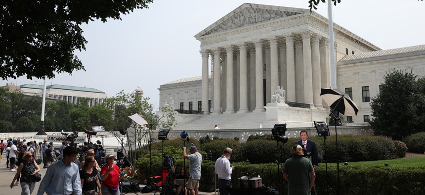 Television news crews report from outside the U.S. Supreme Court on the last day of its term on June 30, 2023 in Washington, D.C. 