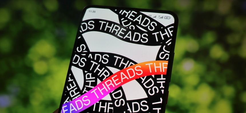 In this photo illustration, the logo for Threads - the new social network from Meta Platforms - is seen displayed on a smartphone. 