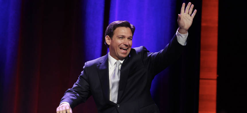 Republican presidential candidate and Florida Gov. Ron DeSantis hits the stage at the Republican Party of Iowa 2023 Lincoln Dinner on July 28, 2023 in Des Moines. 