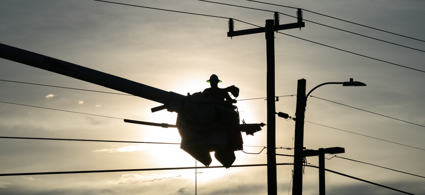 A lineman works to restore service after Hurricane Idalia crossed the state, Aug. 30, 2023 in Perry. The storm made landfall at Keaton Beach, Florida as a category 3 hurricane.