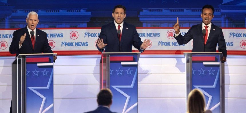 Republican presidential candidates (from left), former Vice President Mike Pence, Florida Gov. Ron DeSantis and entrepreneur Vivek Ramaswamy participate in the first debate of the GOP primary season hosted by FOX News at the Fiserv Forum, Aug. 23, 2023 in Milwaukee, Wisconsin. 
