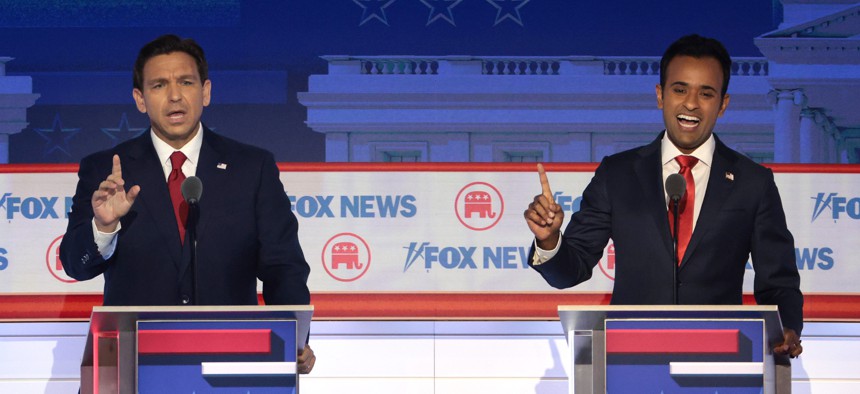 Republican presidential candidates Ron DeSantis (left) and Vivek Ramaswamy participate in the first debate of the GOP primary season hosted by FOX News at the Fiserv Forum on August 23, 2023 in Milwaukee, Wisconsin. 