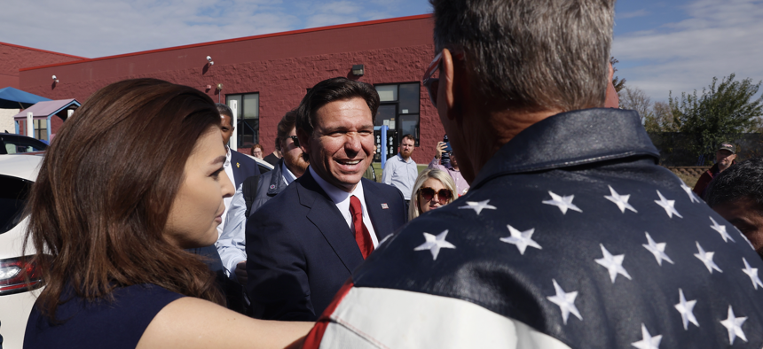 Republican presidential candidate and Florida Gov. Ron DeSantis and wife Casey speak with guests following a campaign event at Refuge City Church, Oct. 8, 2023, in Cedar Rapids, Iowa. DeSantis said Israel can and should defend themselves against the "Hamas terrorists" during the event. 