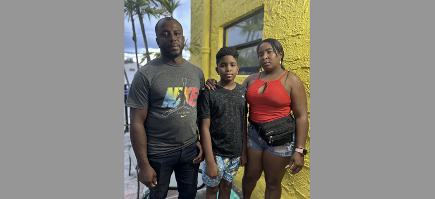 Thirteen-year-old Wistong and his parents made the treacherous journey from their home in Venezuela up through the Darién Gap and Central America to reach the U.S.-Mexico border on foot. They posed outside their Miami apartment on Sept. 14, 2023. 